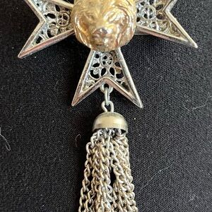 Silver Star Pendant with Lion Design